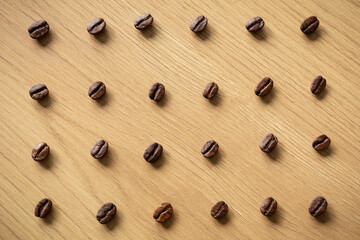 A visually appealing assortment of whole coffee beans on a wooden surface