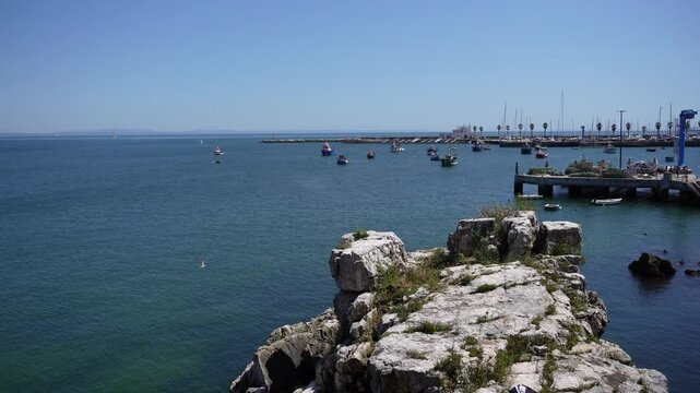 Scenic Coastal View Boats Harbor Rocky Outcrop Sunny Day Portugal