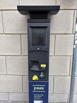 Bratislava, Slovakia - May 19, 2025: modern parking meter in bratislava with digital display and card payment option, urban infrastructure, smart city technology, public services, transportation