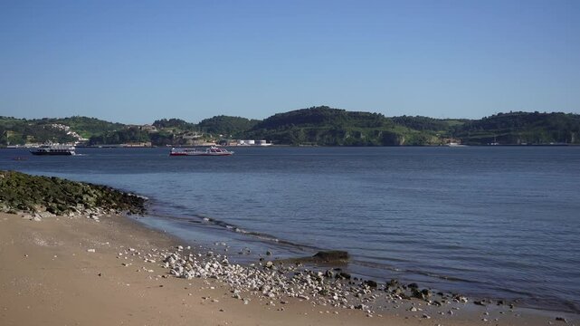 Scenic Coastal View Sandy Beach Fortress Wall and Boats on Calm Bay