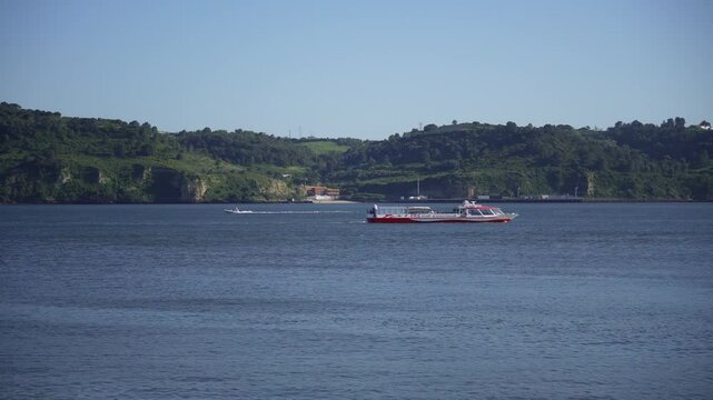 Scenic Coastal View Passenger Ferry Boat on Calm Ocean Waters near Lush Green Hills