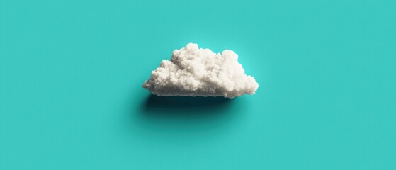 Fototapeta premium A white cloud against a teal background.