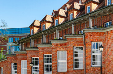 Old brick residential house with tiled roof