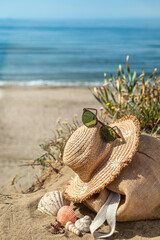 Summer accessories on the sand on the beach