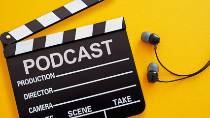 Podcast new episode concept is shown using the text and earphones. Recording studio or podcasting