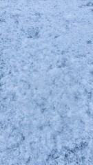 Obraz premium Beautiful macro shot of intricate snow crystals creating clustered patterns on the ground Perfect for winter themed backgrounds and designs