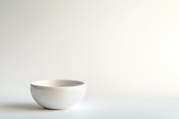 Simple white bowl on a neutral background