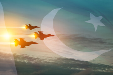 Air Force Day. Aircraft silhouettes on background of sunset with a transparent Pakistan flag.