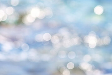Soft focus bokeh light effects water over sea background and texture	