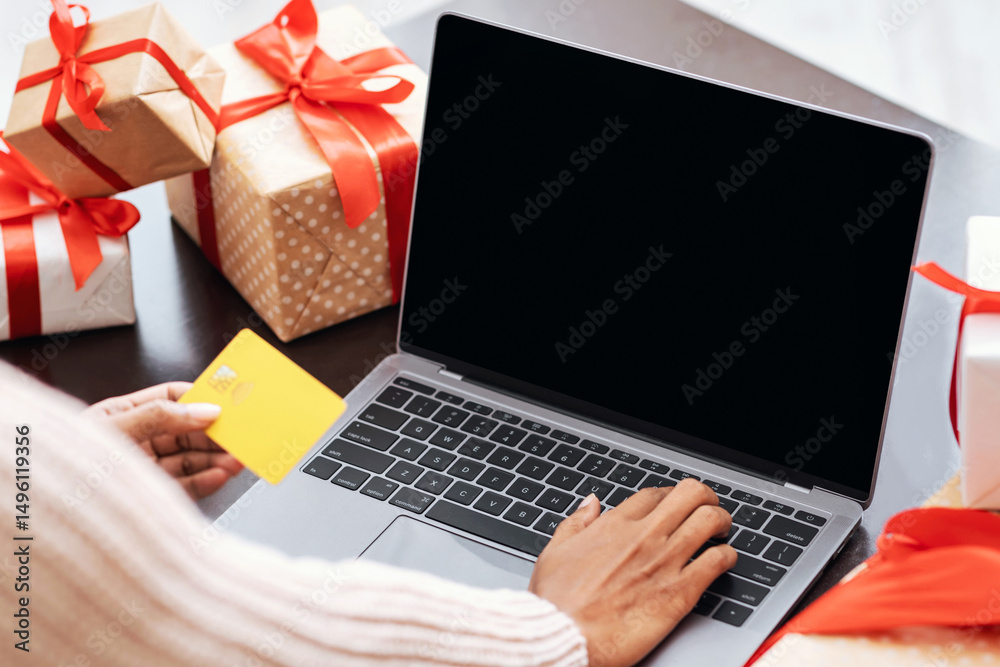 Poster ordering presents. over the shoulder view of african american female customer in protective face mas