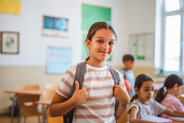 focused school girl pupil sit in school class in the classroom