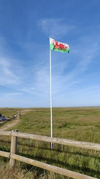 Wales flag flying near Rhyl Beach, North Wales 