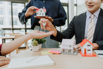 Real Estate Agent Handing Over House Keys