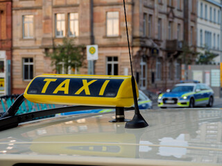 Taxi at Kaiserslautern Train Station with Cityscape Backdrop