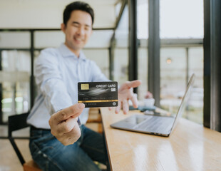 Man Holding Credit Card for Online Payment