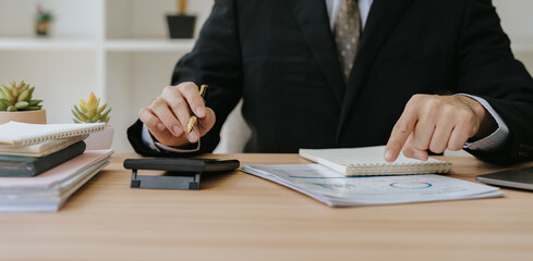 Businessman Analyzing Financial Data at Desk