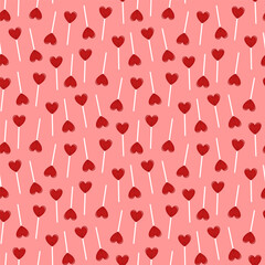 Small lollipops hearts isolated on pink background. Cute seamless pattern. Vector simple flat graphic illustration. Texture.
