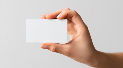 Obraz premium Business Woman's Hand Displaying Credit Card for Payment