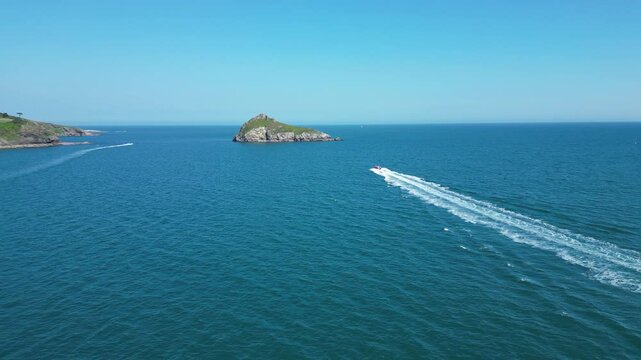 Torbay, South Devon, England: DRONE VIEWS: A speedboat heads across the bay in the direction of Thatcher Rock. Torbay is a popular UK holiday destination (Clip 1).