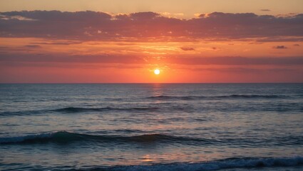 Obraz premium Amazing sunset over the ocean with vibrant colors and calming waves.