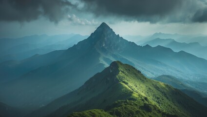 Fototapeta premium A soothing high view of the mountain and peak with green landscape
