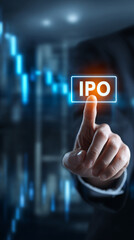 Obraz premium Businessman pressing IPO button in modern office with stock market display