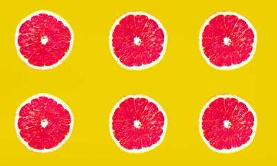 CARA CARA ORANGE SLICES FLAT LAY YELLOW BACKGROUND