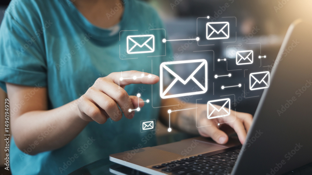 Poster person using laptop with email icons displayed for online communication and digital marketing strate