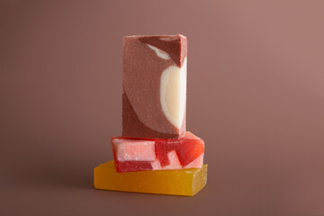  Natural multi-colored solid handmade soap a mocha mousse background. Eco-friendly natural handmade cosmetics. Natural spa products and decor for bath.Color 2025