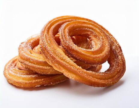 sugar coated fried dough pastries or churo swirl stacked together isolated on a white white background concept of sweet and delicious snack food