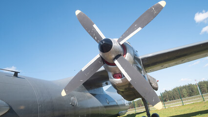 Close-up of a vintage Soviet aircraft propeller showcases the craftsmanship and design of USSR-era aviation, highlighting its historical significance.