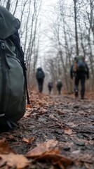 Naklejka premium Travel or hiking bag in the forest with people walking in a forest background with copy space vertically 9:16