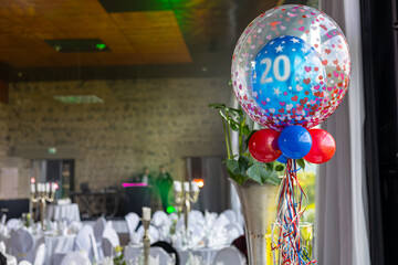 Celebration of a milestone birthday with decorations and a festive atmosphere in an elegant venue