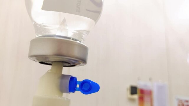 Low angle cinematic shot. saline intravenous drip post in the&nbsp;patient's&nbsp;room