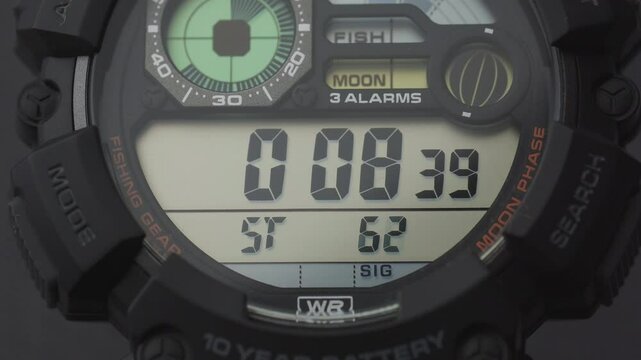Macro close up of a tactical digital watch face functioning
