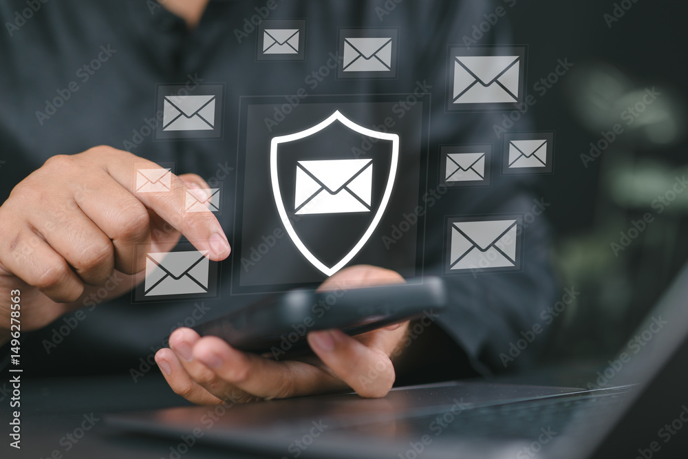 Aufkleber Email security and protection technology concept. A man using a laptop and phone, with virtual email icons and shield, symbolizing data security and communication protection. Cybersecurity threats,