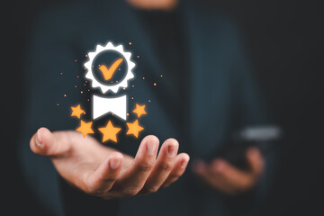 Certified Quality Assurance and Certification Compliance Concept. A man holds a glowing...