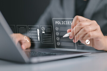 Policy documentation and compliance concept. Businessman reviews digital document Policies with icons, checklists, certifications, and financial detail. Policy management, regulatory compliance,