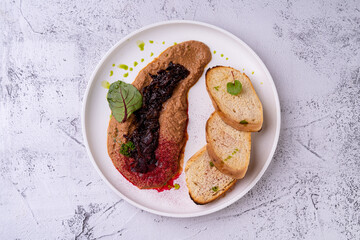 A beautifully arranged plate features gourmet dishes with vibrant colors, highlighting an artistic blend of unique flavors. The stylish presentation invites a culinary adventure to savor