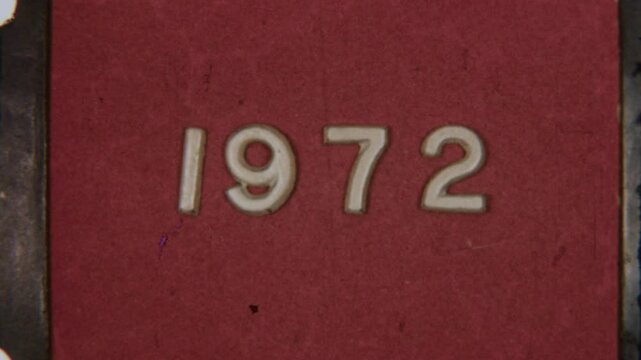 Retro Film Frame Showing 1972 Year On Weathered Red Texture