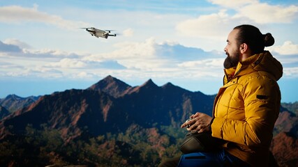 Passionate traveler documents his extreme hiking adventure with a smartphone, capturing a panoramic view. Video content blends nature and technology, wilderness with online followers. Camera A.