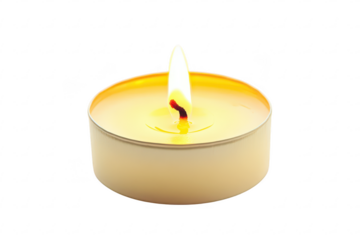 A small tea light candle with a bright burning flame in a metal cup used for ambiance and decor isolated on a transparent background