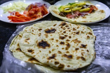 The most traditional and classic shawarma prepared in Syrian bread or pita bread grilled on a stone