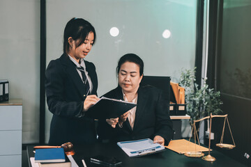 Judge gavel with Justice lawyers, Business woam in suit or lawyer working on a documents. Legal law, advice and justice concept..