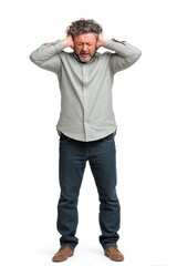 Naklejka premium A man covering his ears and appearing stressed or frustrated against a white background.