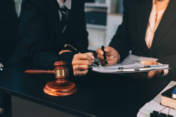 Judge gavel with Justice lawyers, Business woam in suit or lawyer working on a documents. Legal law, advice and justice concept..