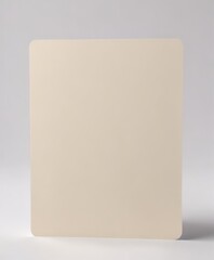 Fototapeta premium Cream-colored card blanks casually spread across a pristine white background, some edges slightly overlapping , clean, unwritten