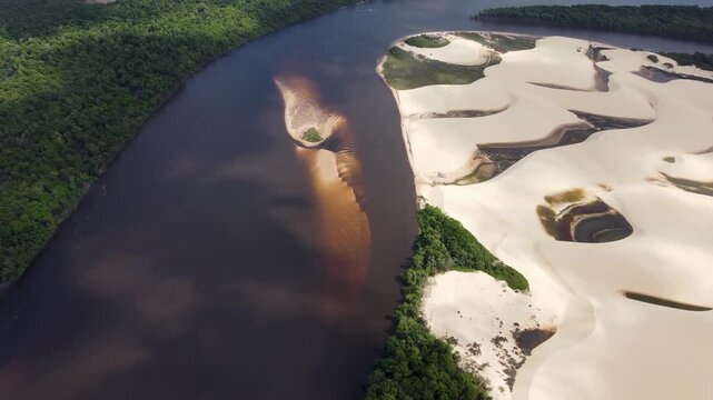 Mandacaru Island In Lencois Maranhenses Maranhao Brazil. Tropical River With A Scenic Forest Trees Viewed From Above. Shore Clouds Beach Sea. Outside Beach Panning Wide. Lencois Maranhenses Maranhao.