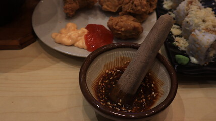 cutlery in Japanese restaurants, bowls and sticks for mixing sauces.