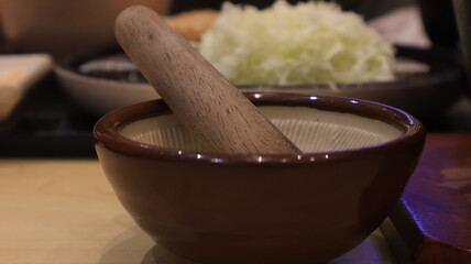 cutlery in Japanese restaurants, bowls and sticks for mixing sauces.